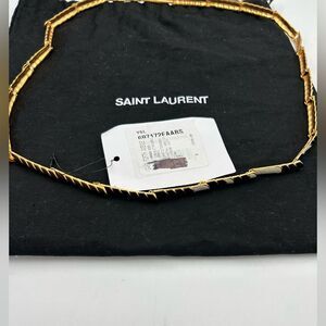 Women’s St. Laurent, gold toned necklace with alternating long and short links